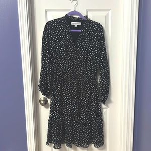 Beautiful black dress with white polka dot design.